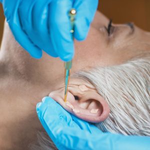 senior getting auricular acupuncture